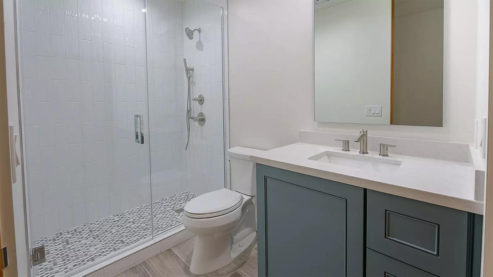 A Phoenix Contemporary designed bathroom with a shower and toilet