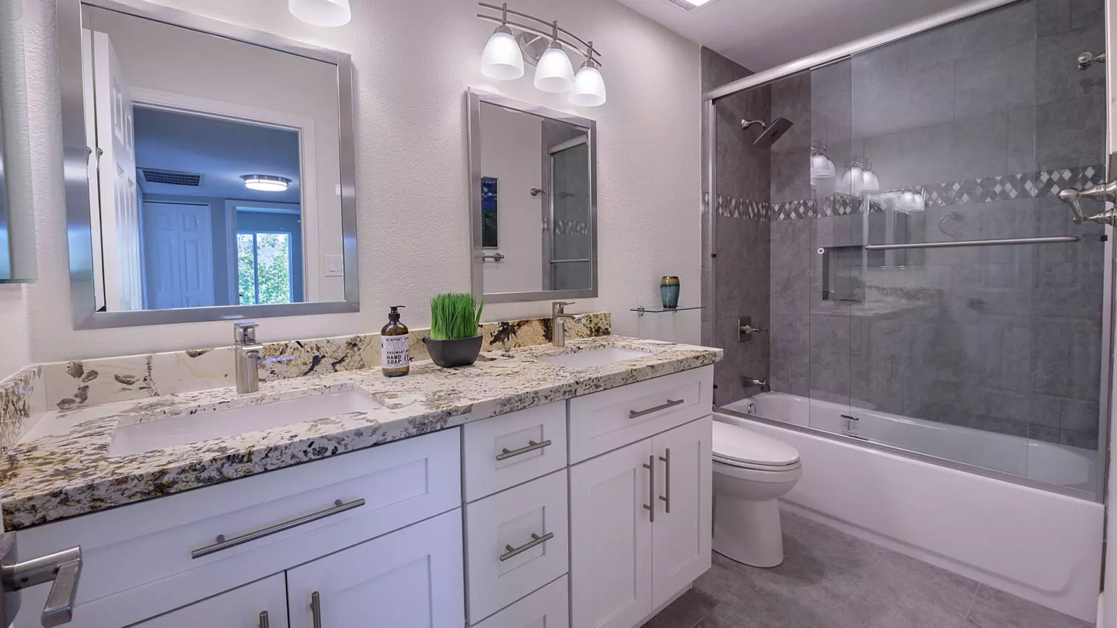 The vanity and shower of a Scottsdale Shaker designed bathroom